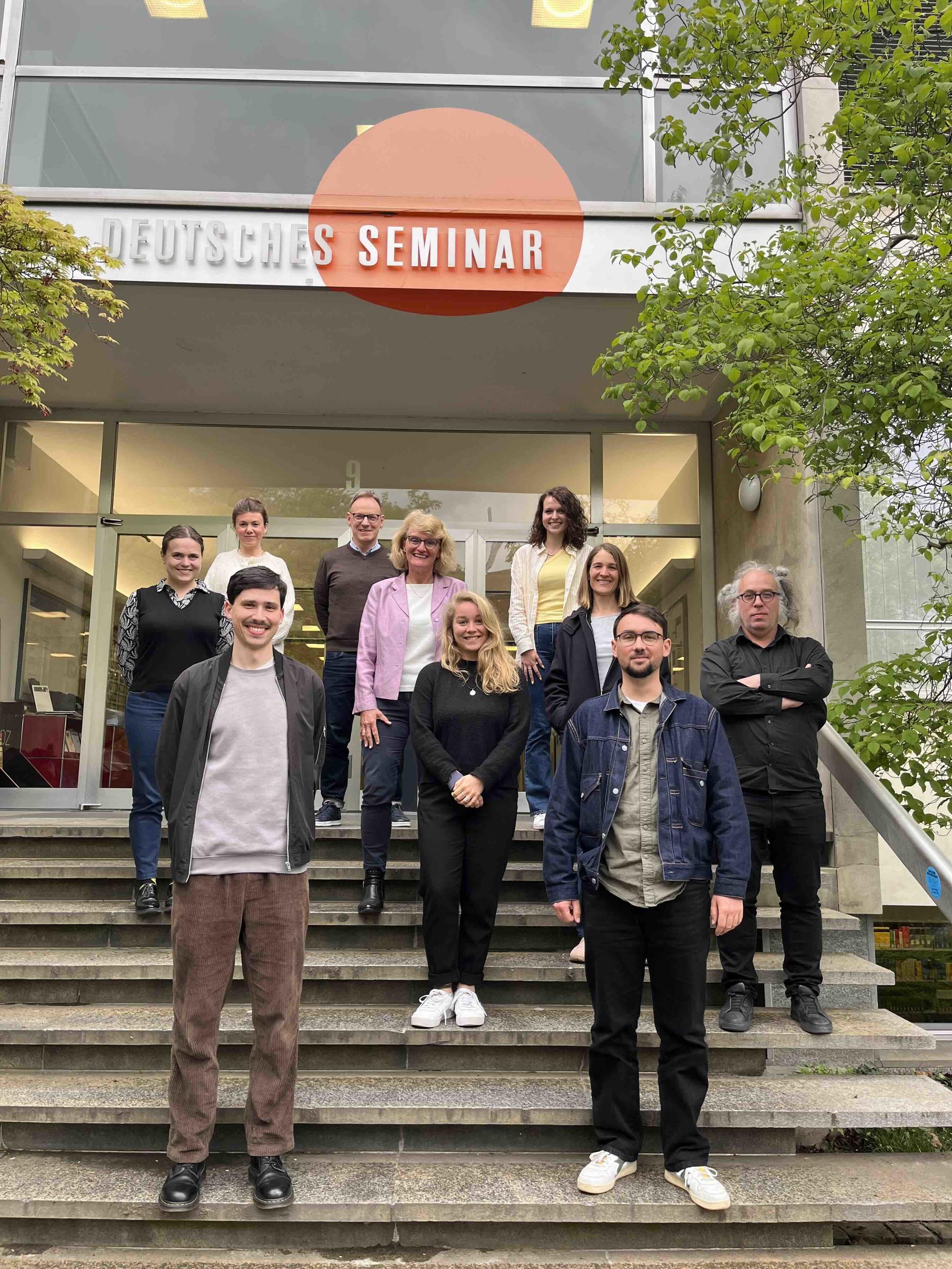 Team in front of the university
