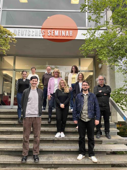 Team in front of the university